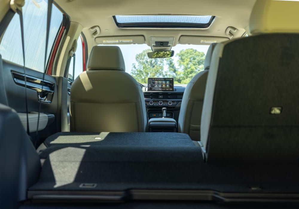 honda-crv-cargo-space.png Cargo space in the back of a 2025 Honda CR-V. Middle row of seats is partially folded down
