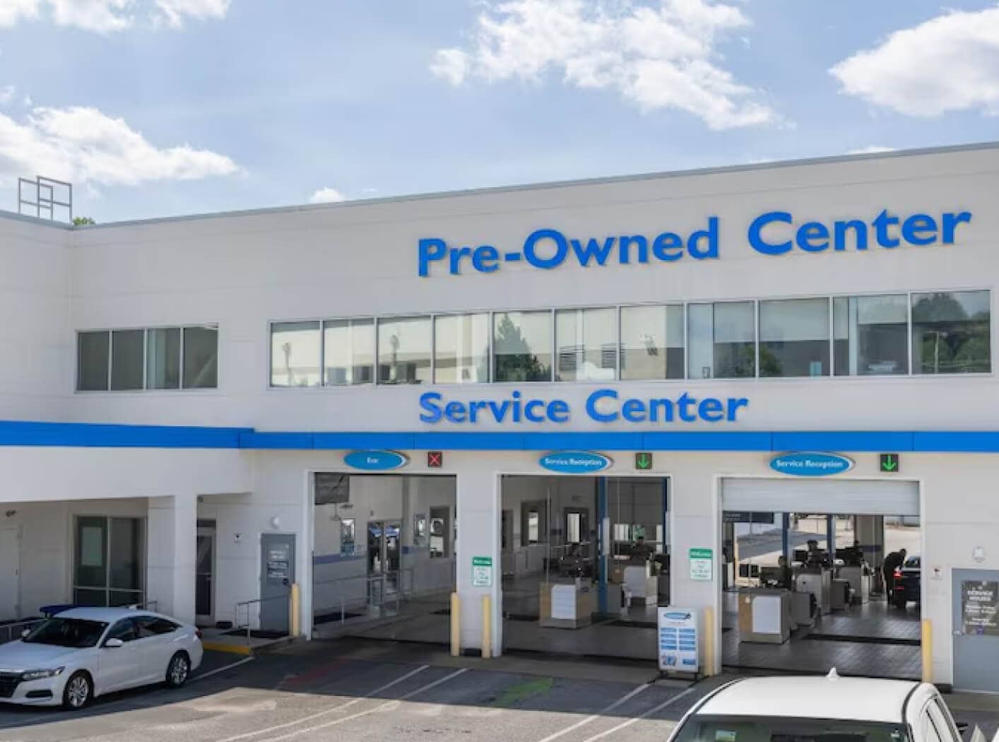 Outside view of the Honda Service Center and Pre-Owned Center at Flow Honda in Winston-Salem