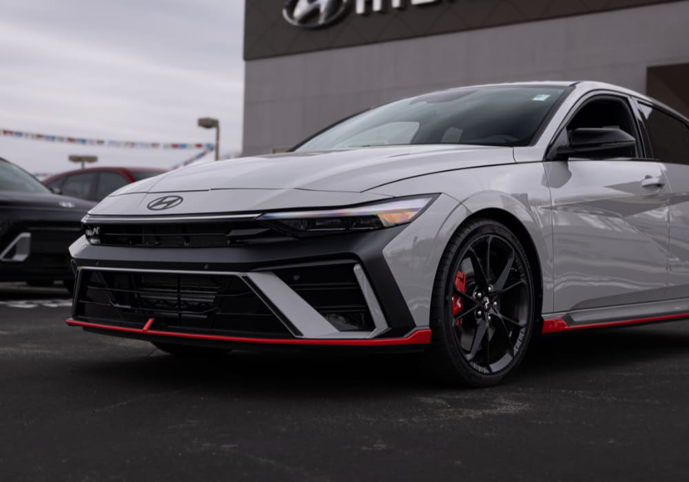 Gray 2026 Hyundai Elanta for sale parked in front of a Hyundai dealership