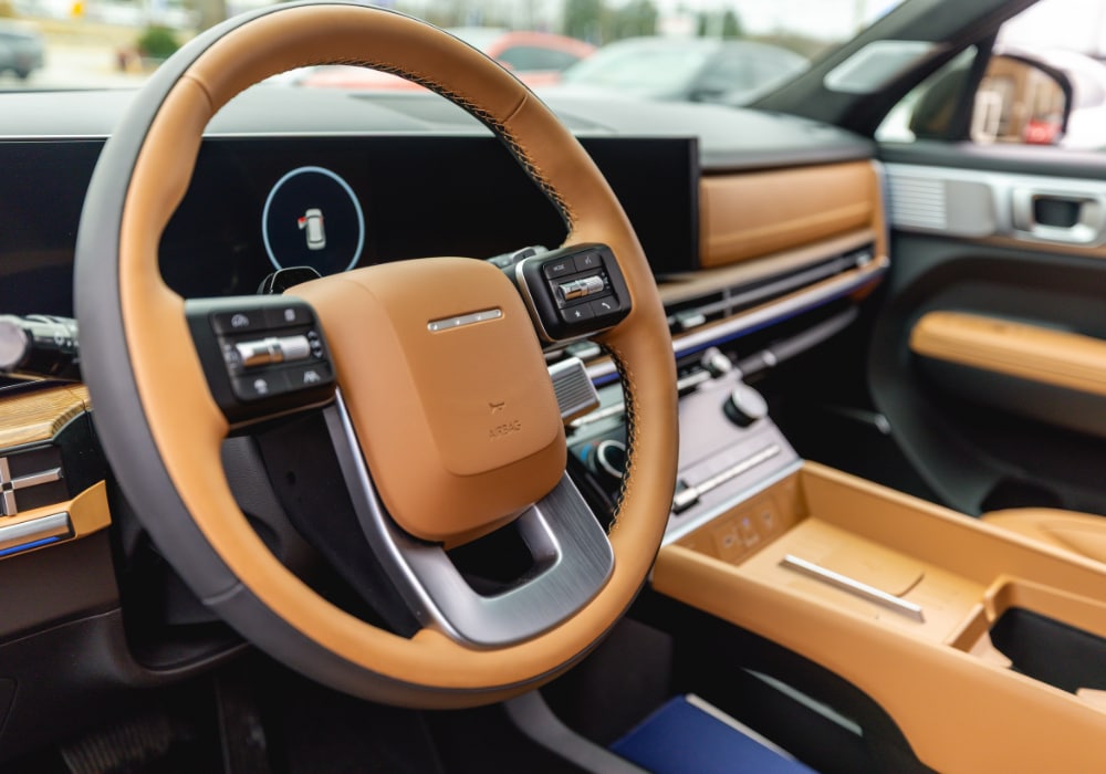 Hyundai Santa Fe interior, featuring the front dash. The interior is made up of a large brown leather material