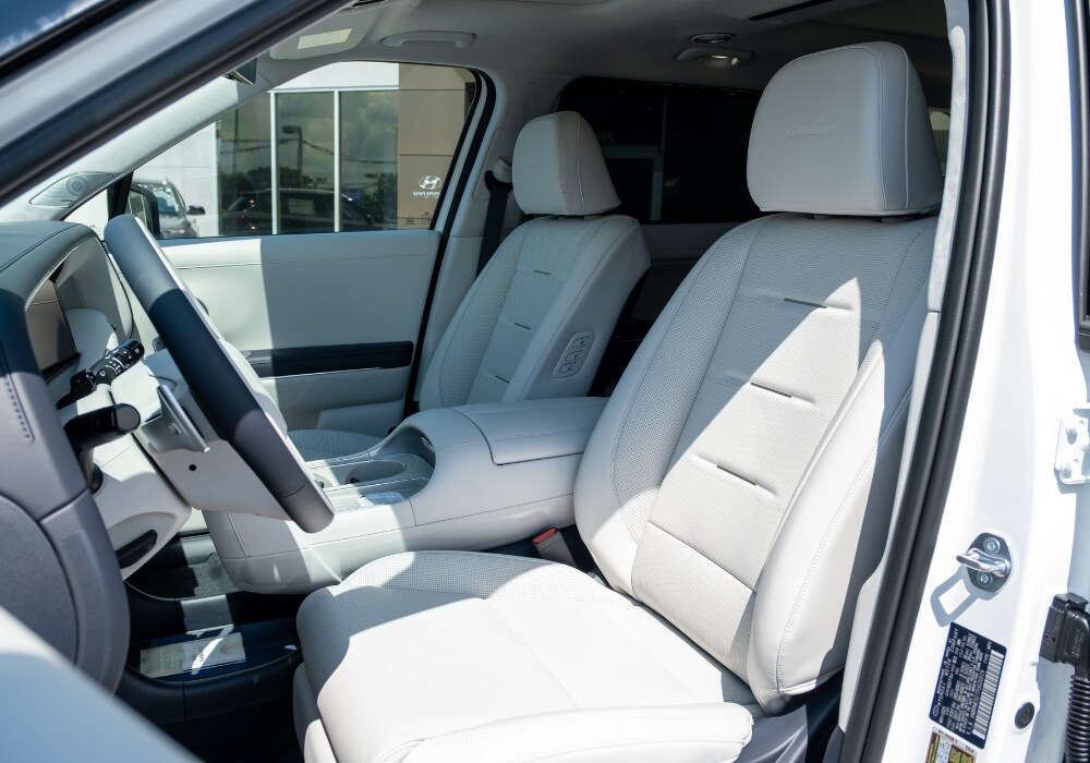 hyundai-palisade-interior.png 2025 Hyundai Palisade interior, the seats are a white leather