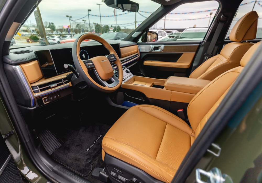 Hyundai Santa Fe interior. The seats are made of a light brown leather material