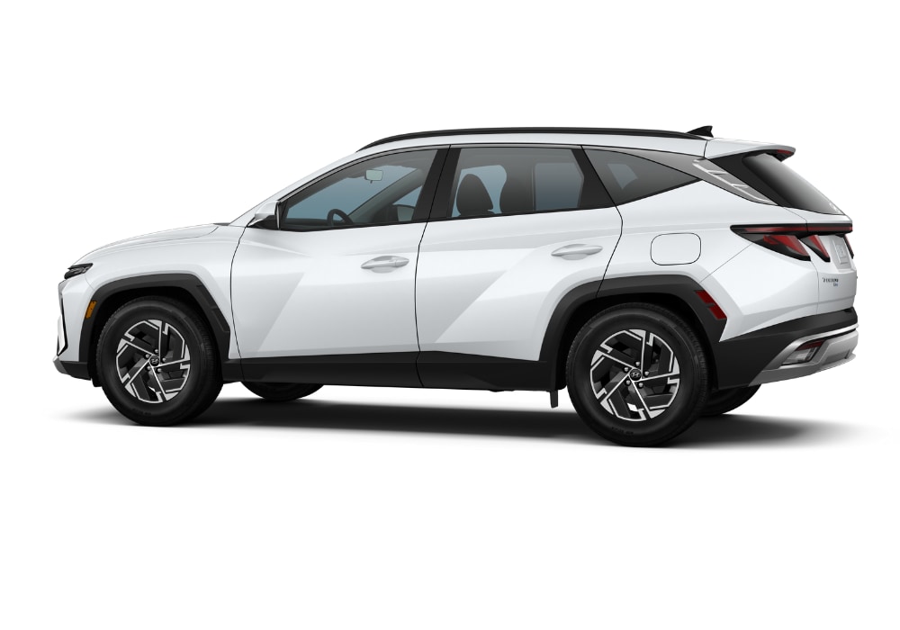 Passenger side view of a 2025 Hyundai Tucson SUV in front of a white background