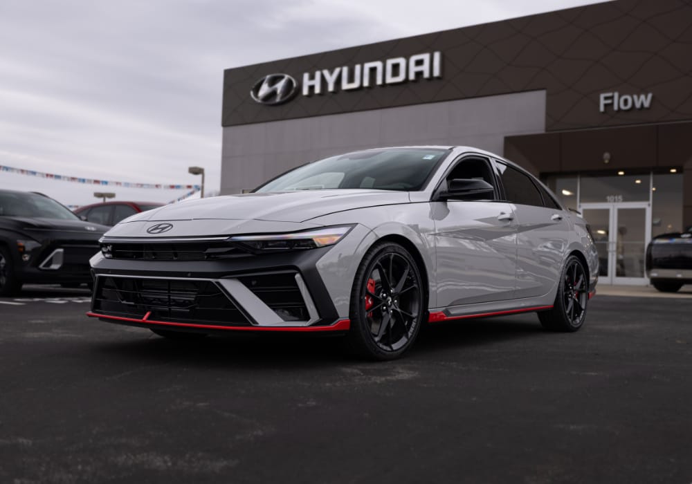 Gray 2026 Hyundai Elantra parked in front of the Flow Hyundai of Statesville dealership