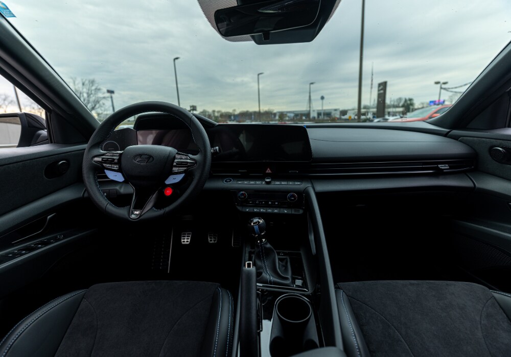 Hyundai Elantra interior, including the steering wheel and infotainment system