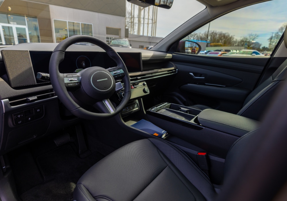 2026 Hyundai Tucson interior, featuring the infotainment system and steering wheel