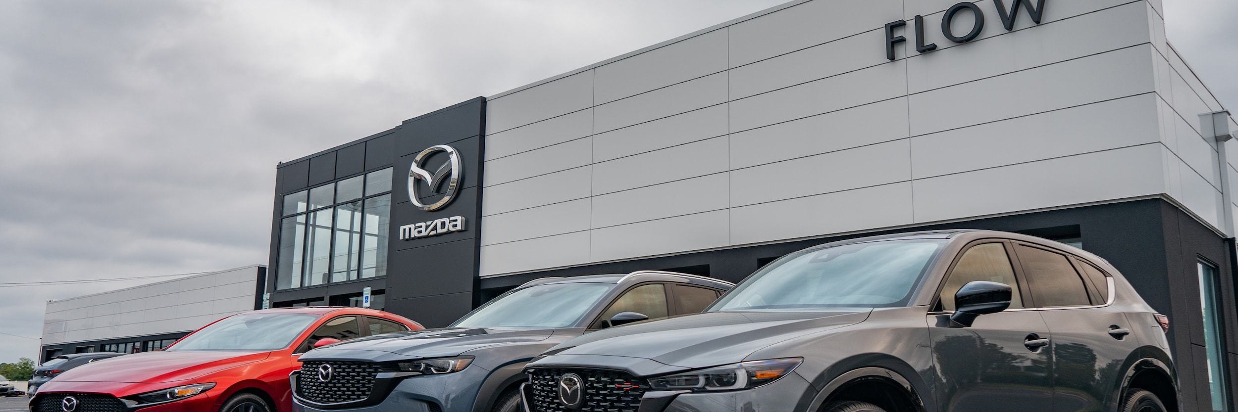 Storefront of Flow Mazda dealership in Fayetteville NC