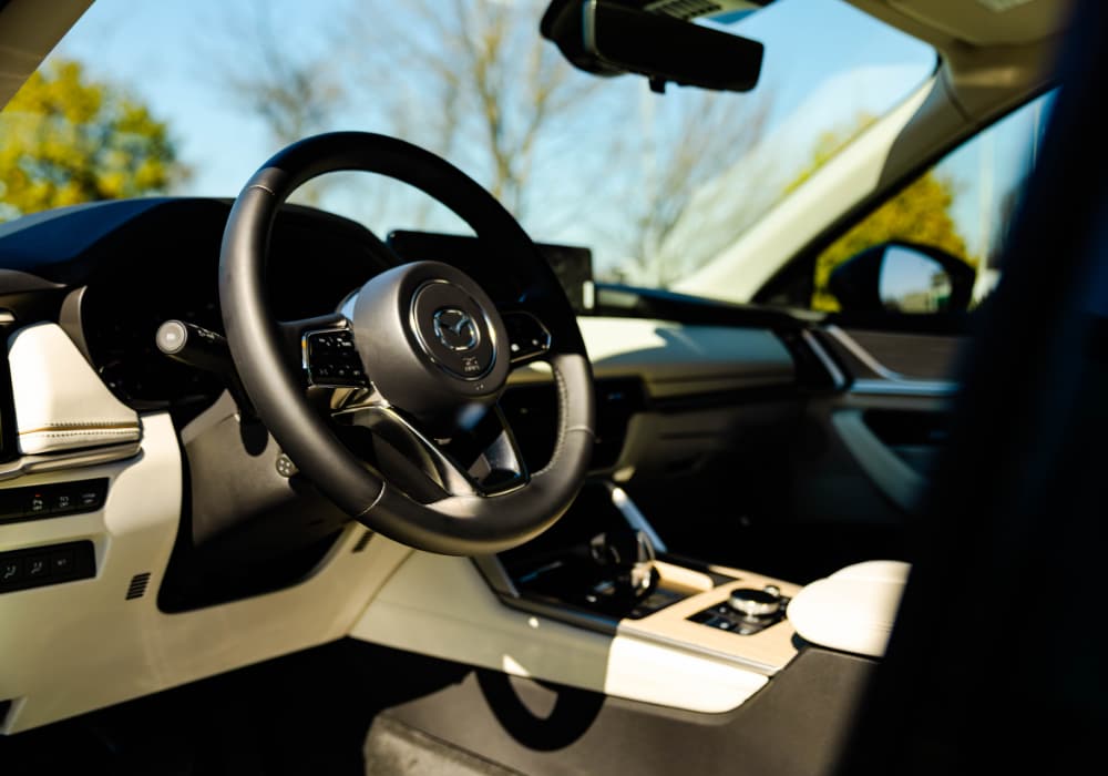2025 Mazda CX-90 interior, including the steering wheel and front dash