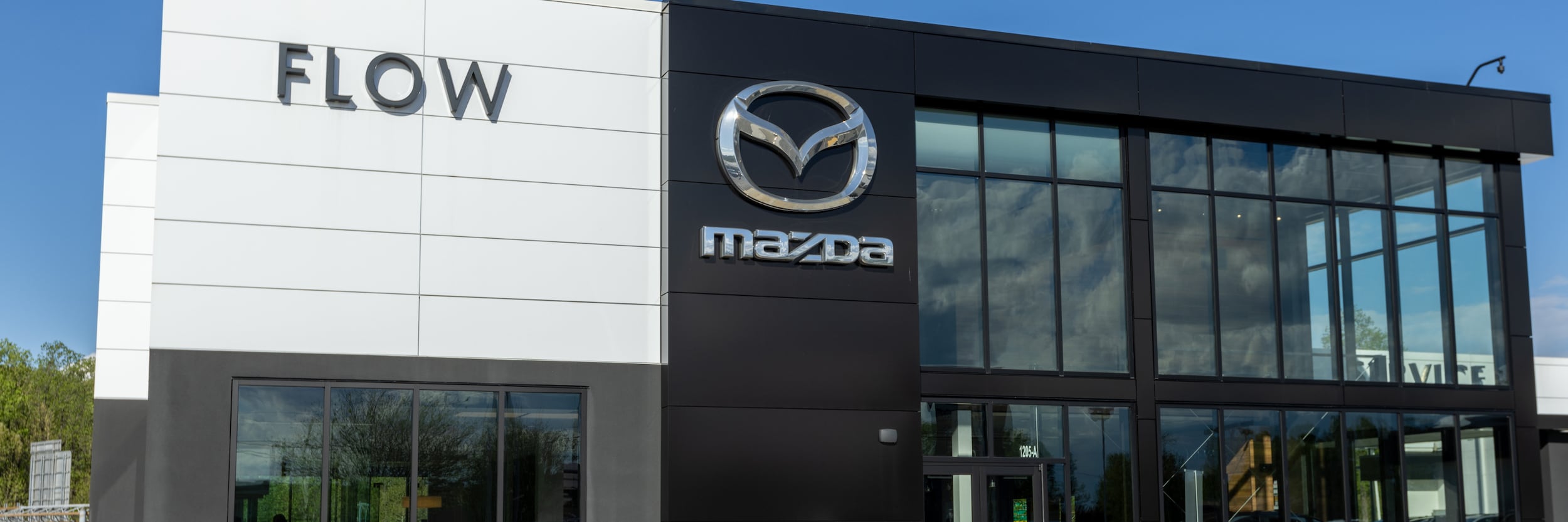 Storefront of Flow Mazda dealership in Greensboro NC