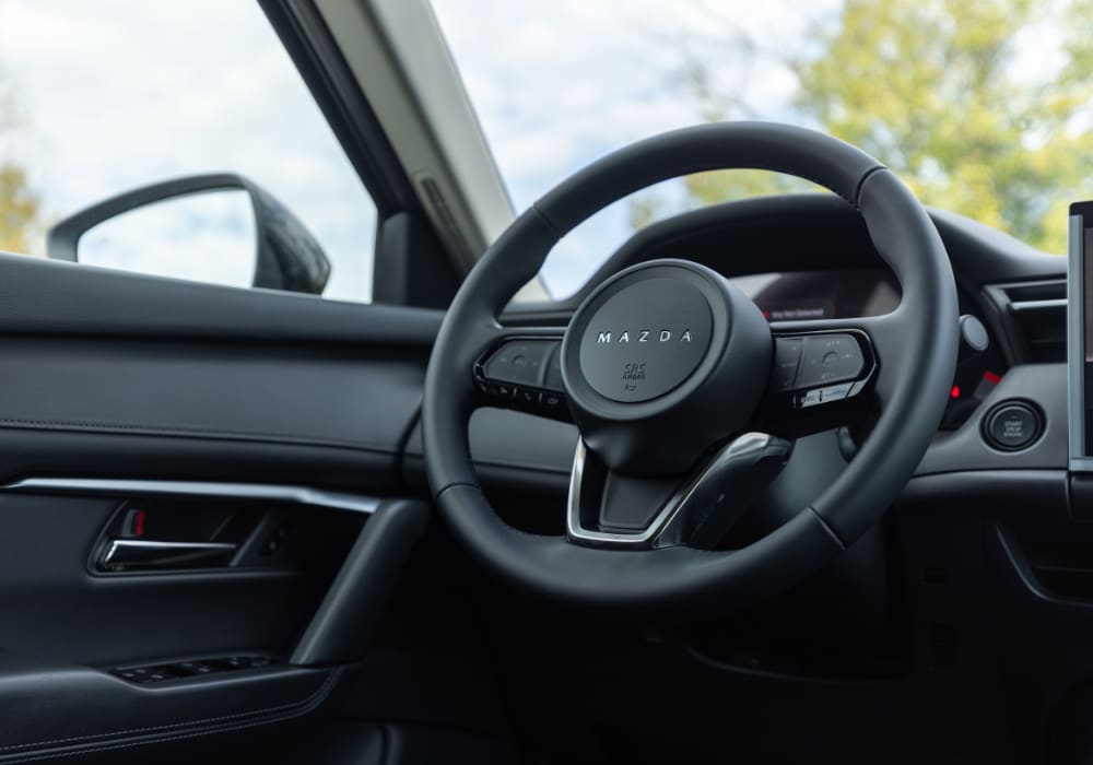 2026 Mazda CX-5 interior, featuring the steering wheel