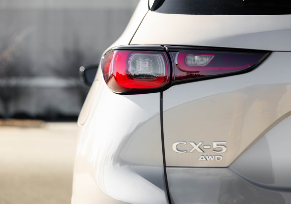 Close up photo of the exterior rear of a new Mazda Cx-5. The CX-5 AWD logo is visible below the back headlight