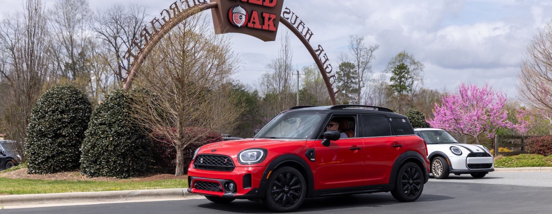 Red Mini Cooper in front of the Red Oak brewery archway