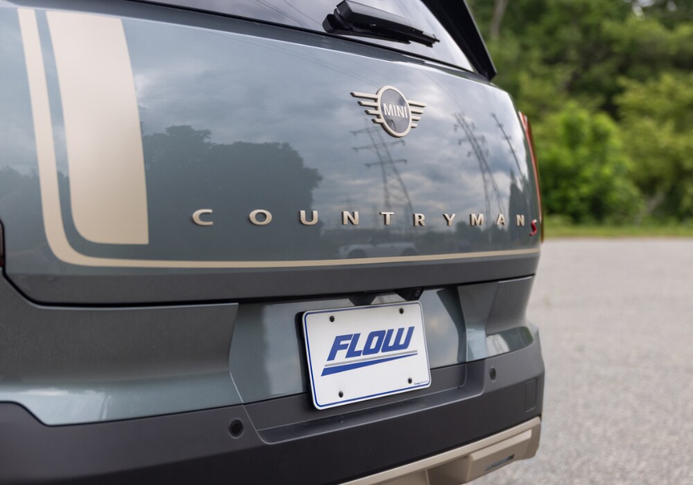 Rear bumper of a new Mini Countryman. The car has a Flow Automotive vanity plate