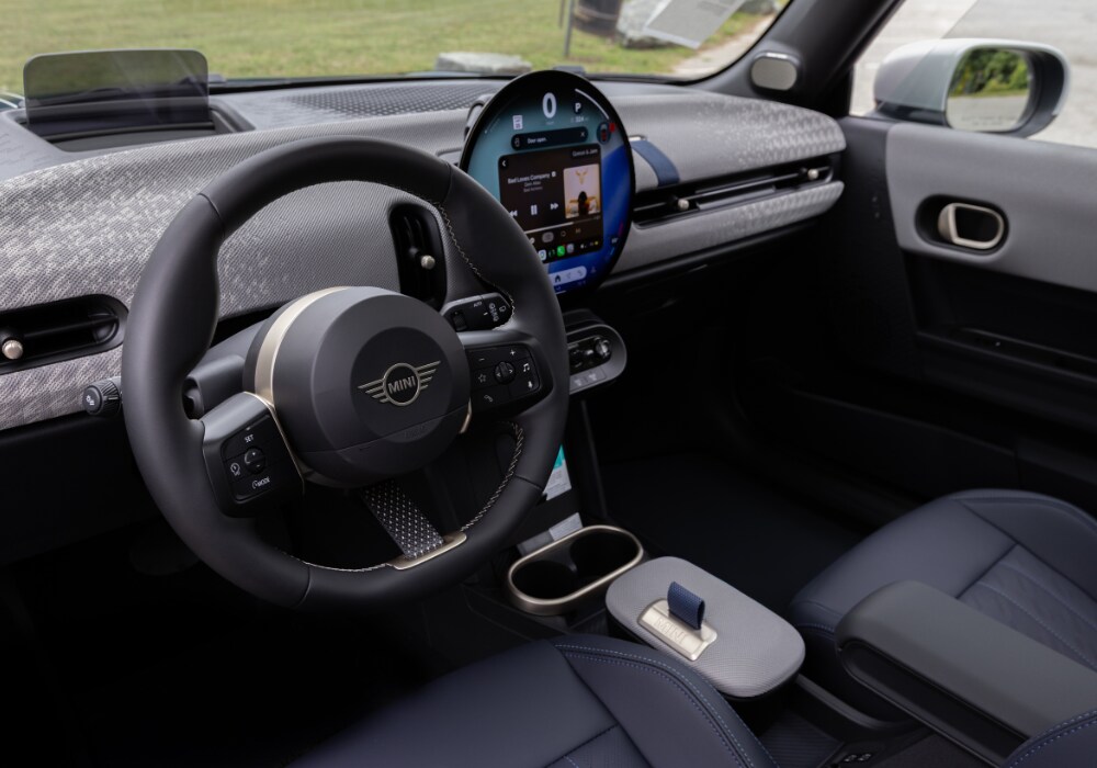 Interior of the 2026 2 Door Mini Cooper, featuring the infotainment system and steering wheel
