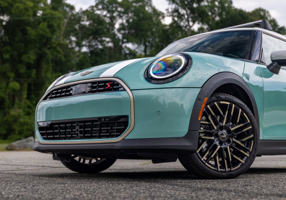 Close up of the front of a 2026 Mini Cooper 4 Door in the color teal