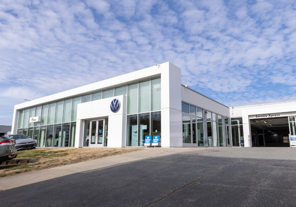 Flow Volkswagen of Winston-Salem dealership with cars parked out front