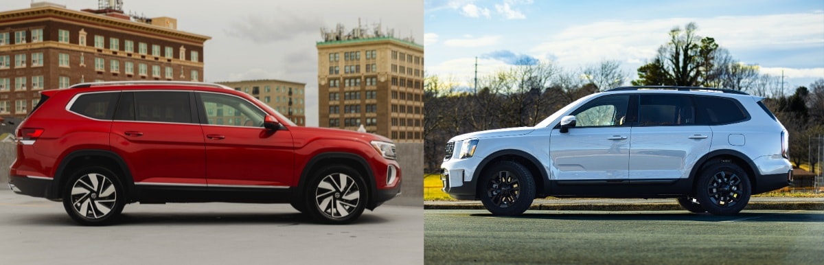 A red Volkswagen Atlas next to a Kia Telluride. The vehicles are facing each other