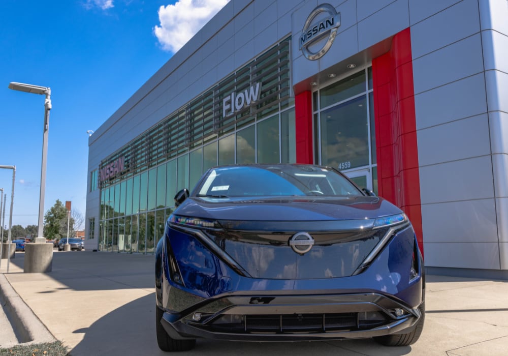New Nissan SUV for sale parked in front of Flow Nissan of Fayetteville