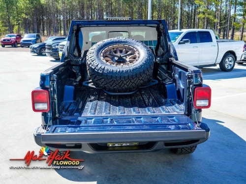 2025 Jeep Gladiator bed of truck hauling a tire