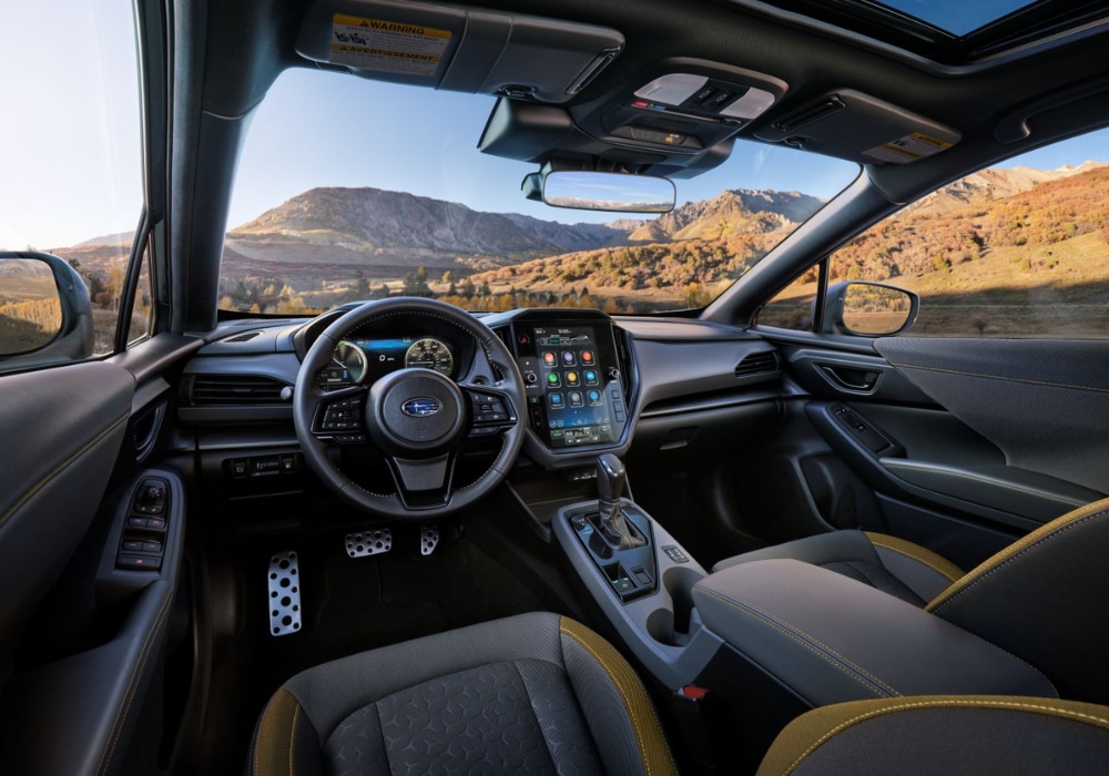 Subaru Crosstrek Hybrid Interior front dash. There is a view of mountains out of the front windshield