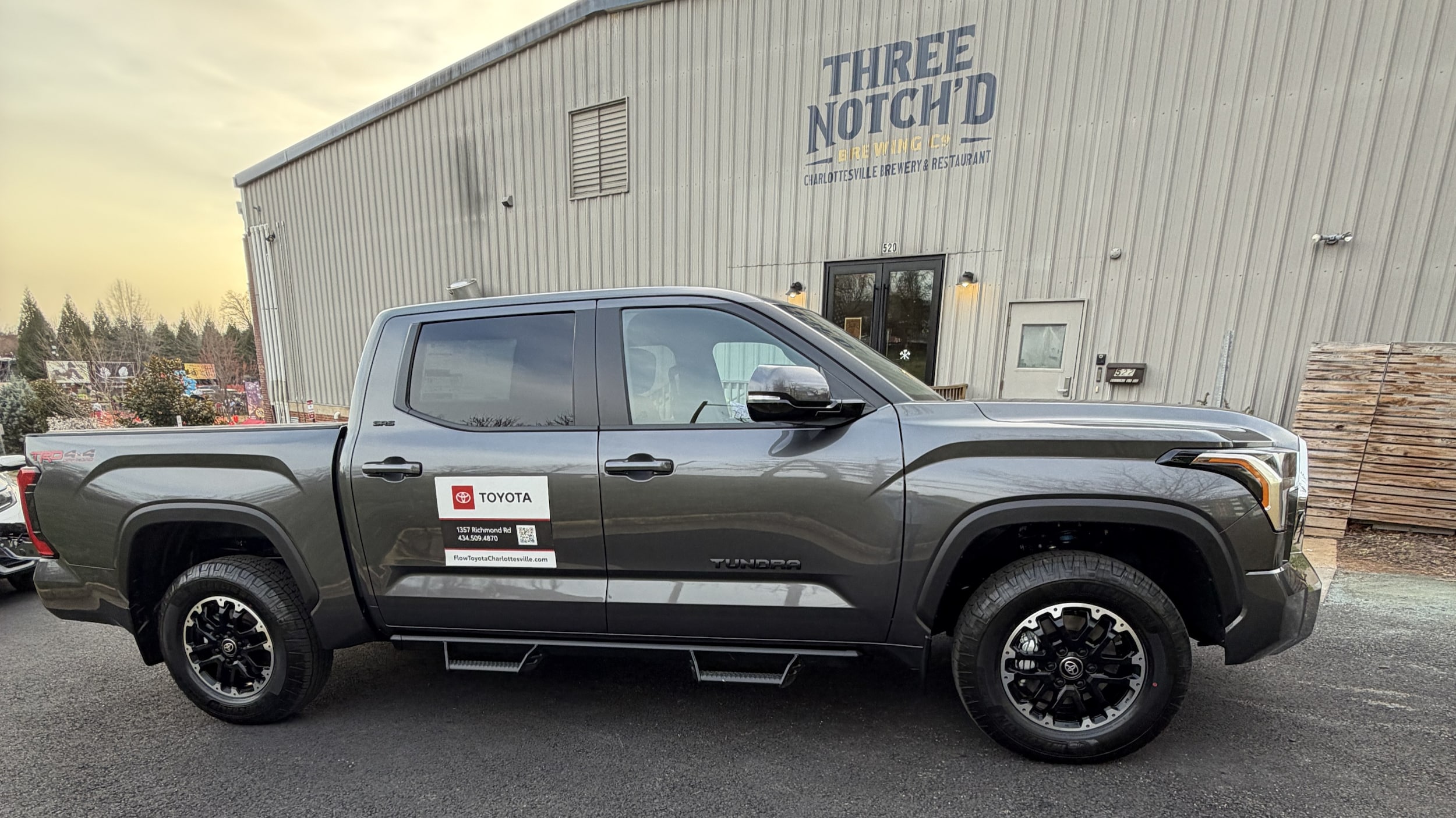 a new toyota tundra sitting in front of a local venue