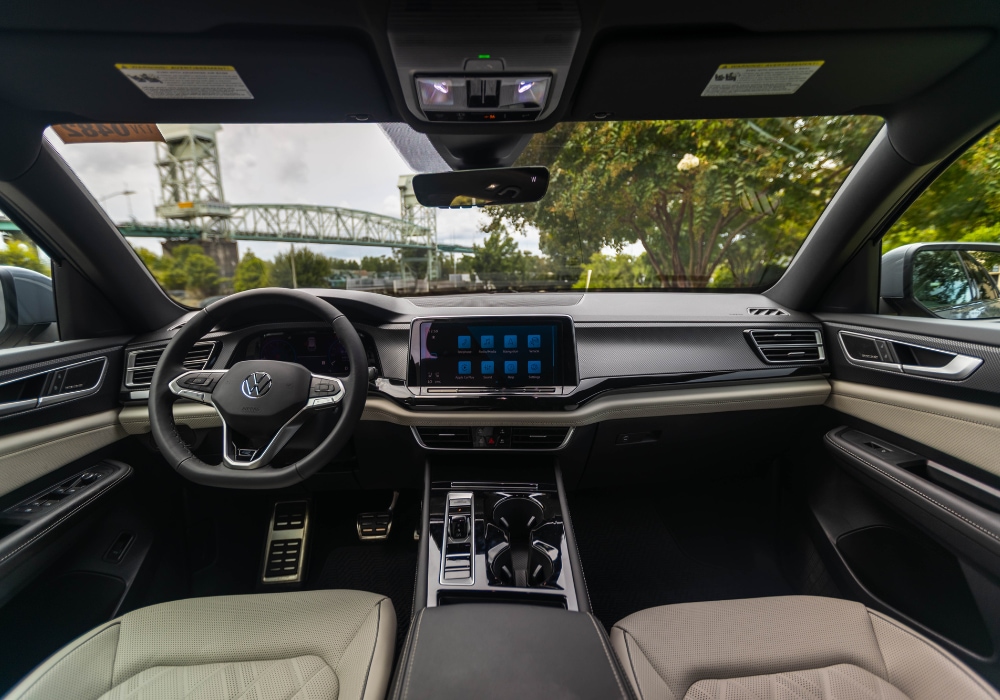 2025 Volkswagen Atlas Cross Sport interior including the infotainment system, center console, and steering wheel