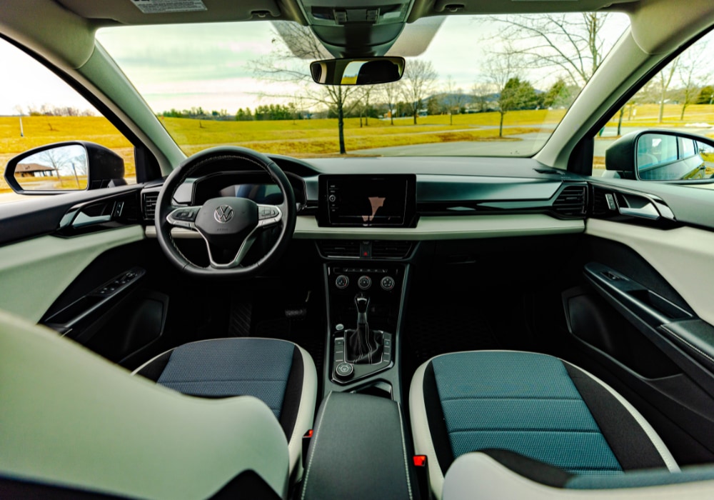 Volkswagen Taos interior, showing the front seats, front dash, and view from the front window