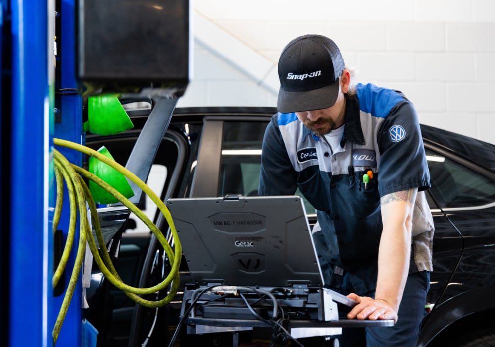 Volkswagen service technician using a computer