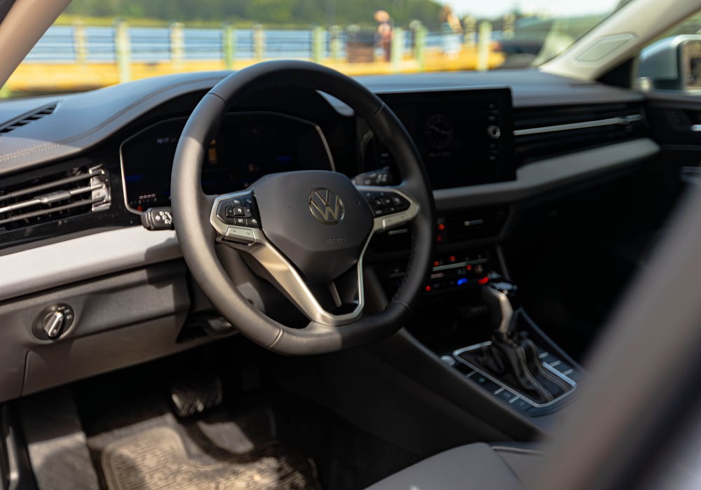 Volkswagen Jetta interior, including the steering wheel and infotainment system
