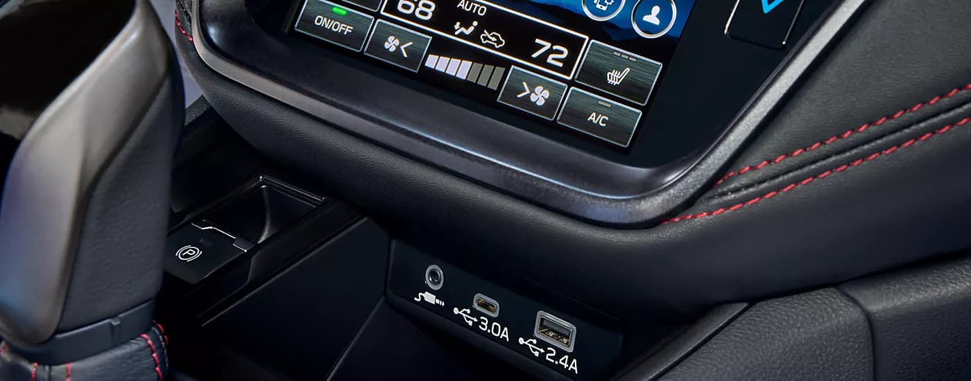 A close up shows the USB ports and HVAC options in a 2023 Subaru Legacy.