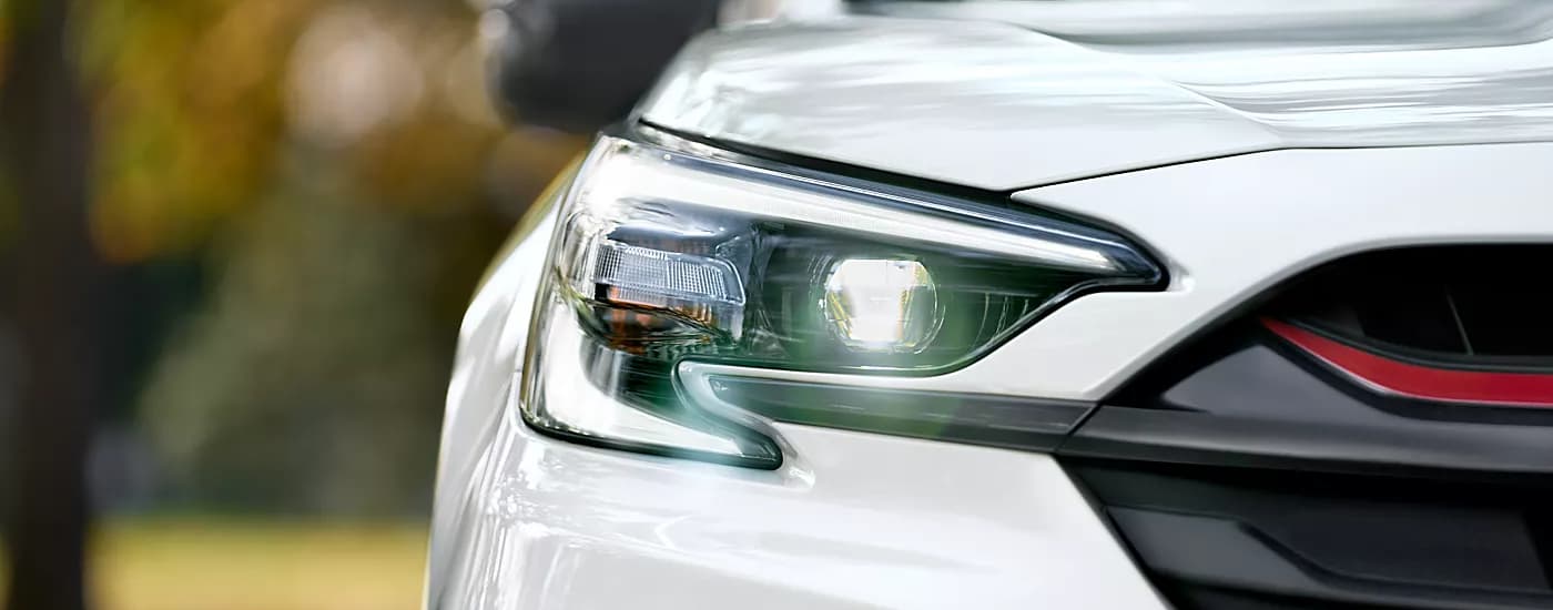 A close up shows the passenger side headlight on a 2023 Subaru Legacy.