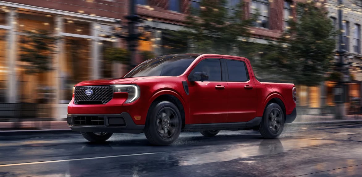 Red 2026 Ford Maverick Lariat on wet road