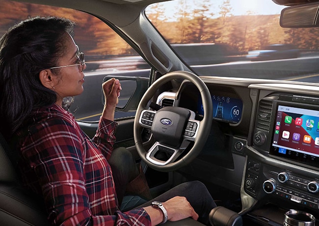 Driver's perspective of the Head-Up Display projected on to the windshield viewing the Ford BlueCruise screen