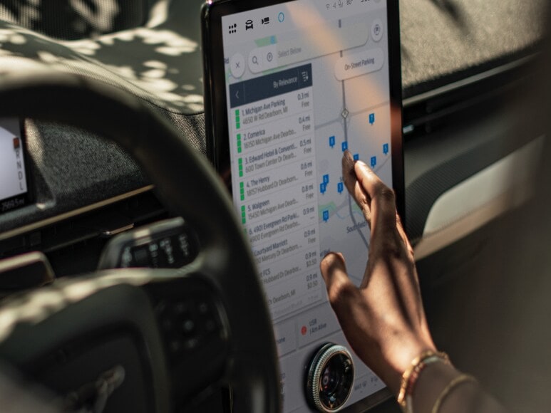  A Ford vehicle technology screen shows multiple locations listed and pinpointed on Google Maps. Screen may vary.