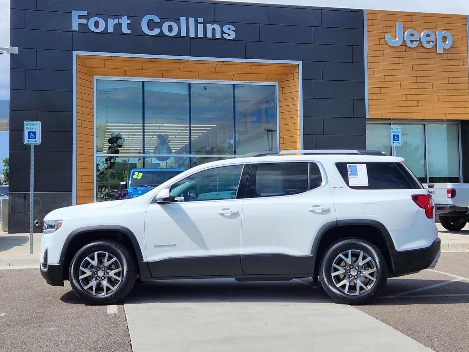 Used 2021 GMC Acadia SLE with VIN 1GKKNRL47MZ155504 for sale in Fort Collins, CO