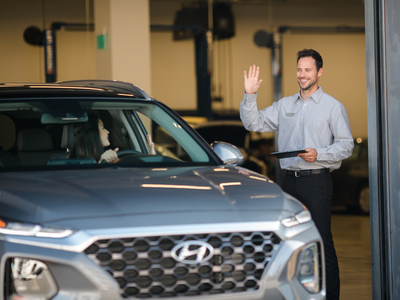 Dealer attendant greeting a client