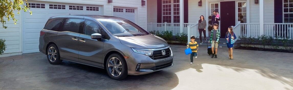 Family Walking Toward Their New Honda Odyssey