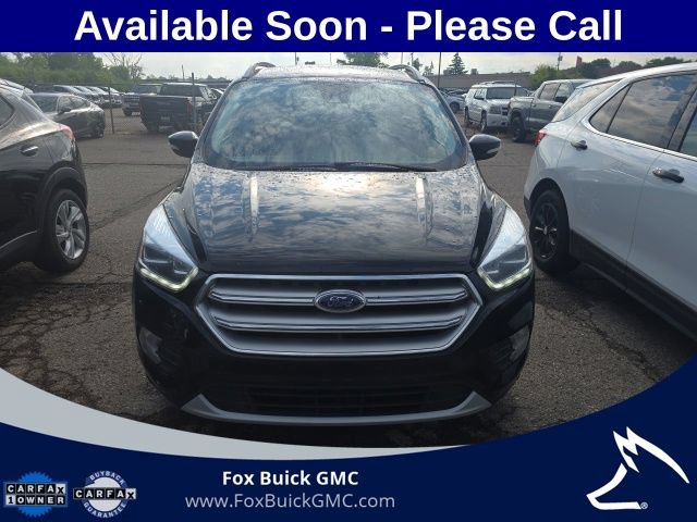Used 2017 Ford Escape Titanium with VIN 1FMCU0JD0HUB14406 for sale in Farmington, MI