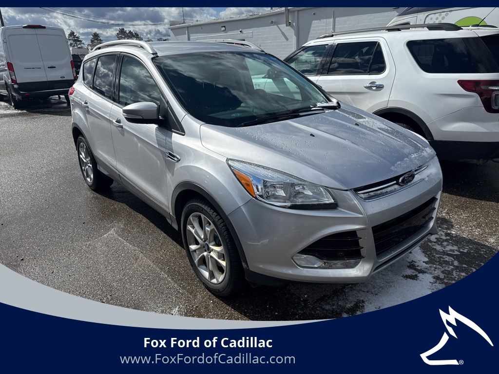 Used 2016 Ford Escape Titanium with VIN 1FMCU9JX7GUA28703 for sale in Cadillac, MI