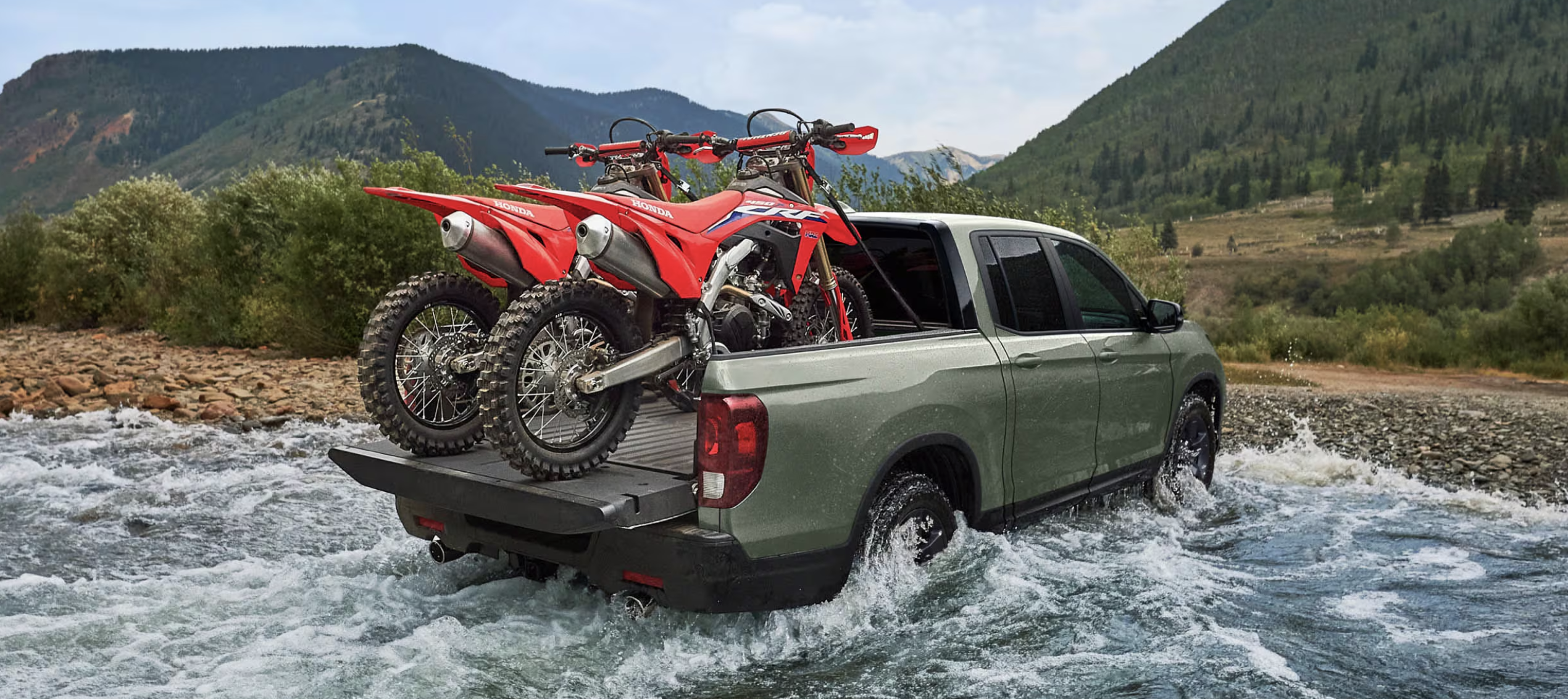Honda Ridgeline driving across a river Honda Ridgeline driving across a river