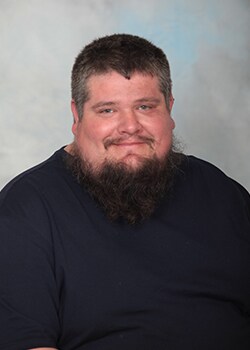 Staff member David Thompson from ID_65797b