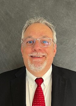 Staff member Greg Hozak from ID_951717
