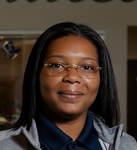 Staff member Aisha Harris from ID_6ff08e