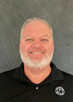 Staff member David Purchase from ID_951717