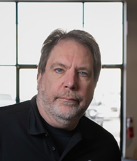 Staff member Tom Gatesy from ID_379874