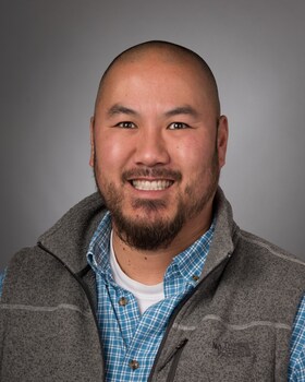 Staff member Aaron Rohrer from ID_746018