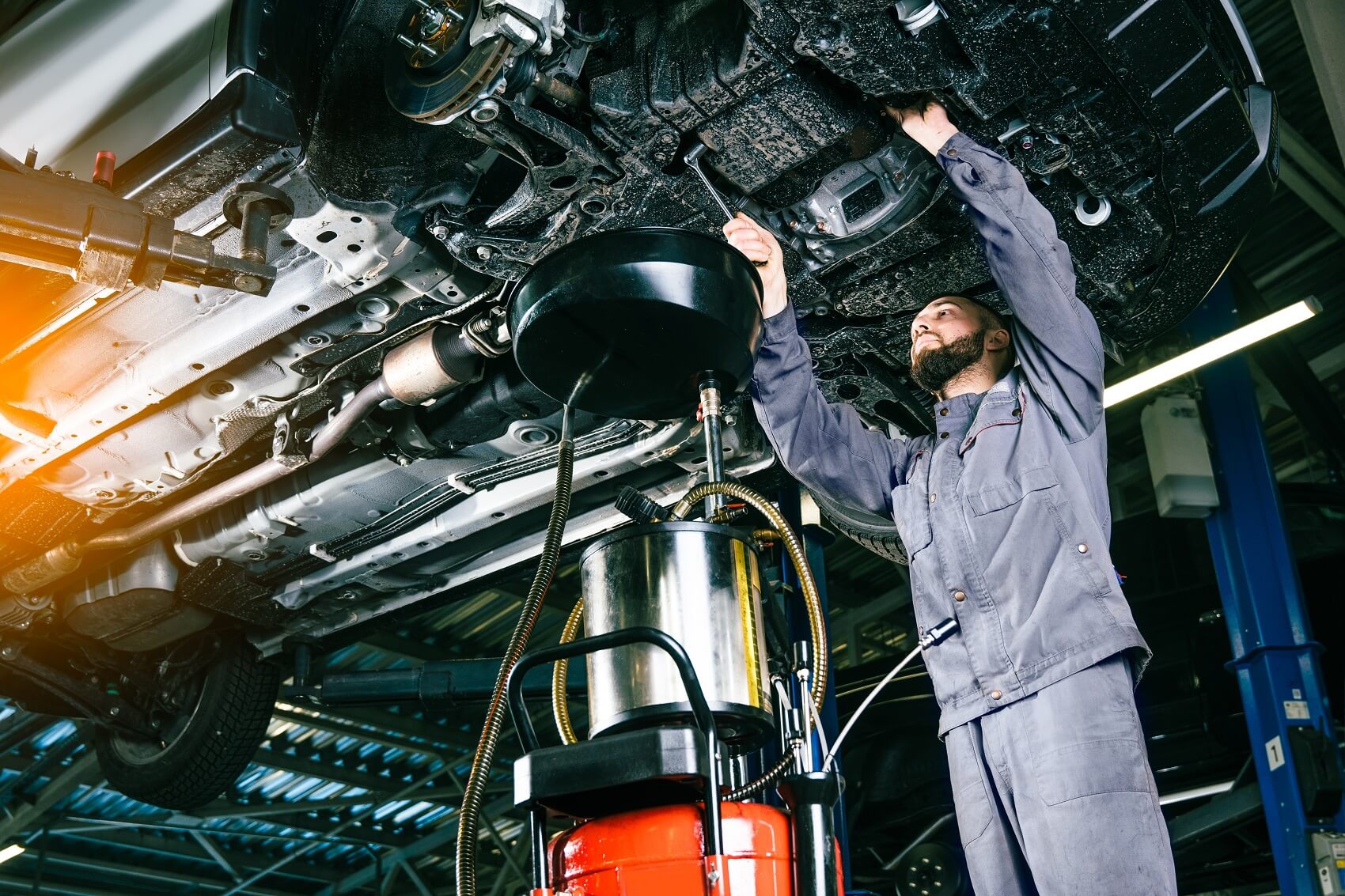 Service Technician Working on a Used Car
