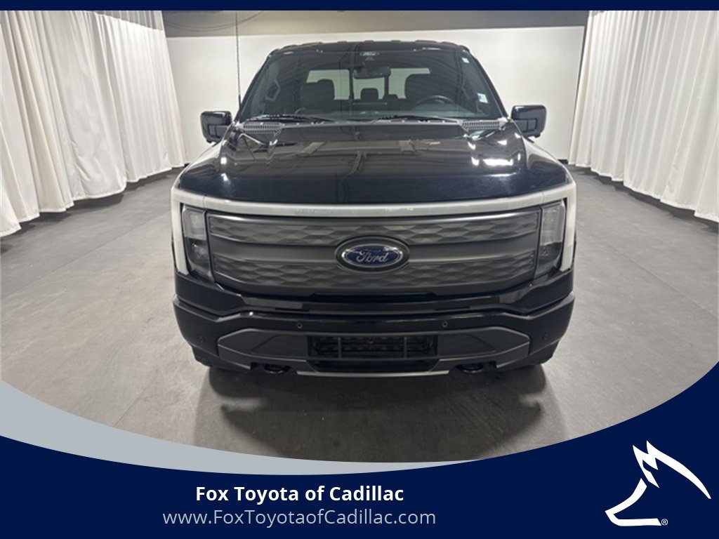Used 2022 Ford F-150 Lightning Lariat with VIN 1FTVW1EL5NWG00918 for sale in Cadillac, MI