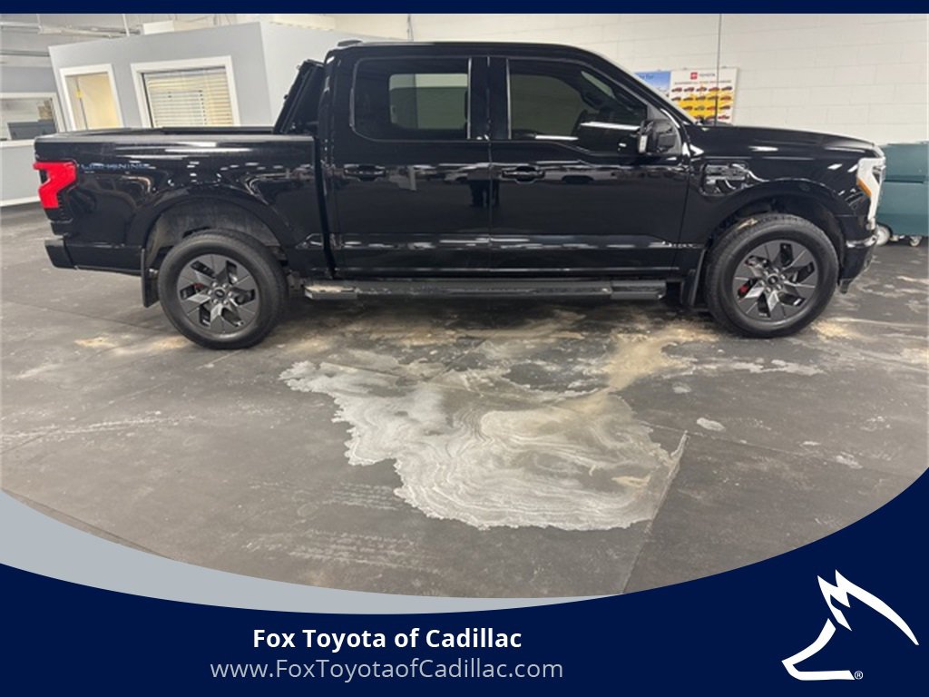 Used 2022 Ford F-150 Lightning Lariat with VIN 1FTVW1EL5NWG00918 for sale in Cadillac, MI