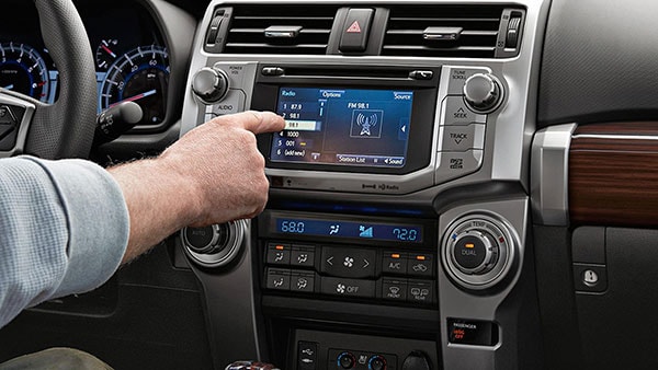 A man using the infotainment system of the 2019 Toyota 4Runner